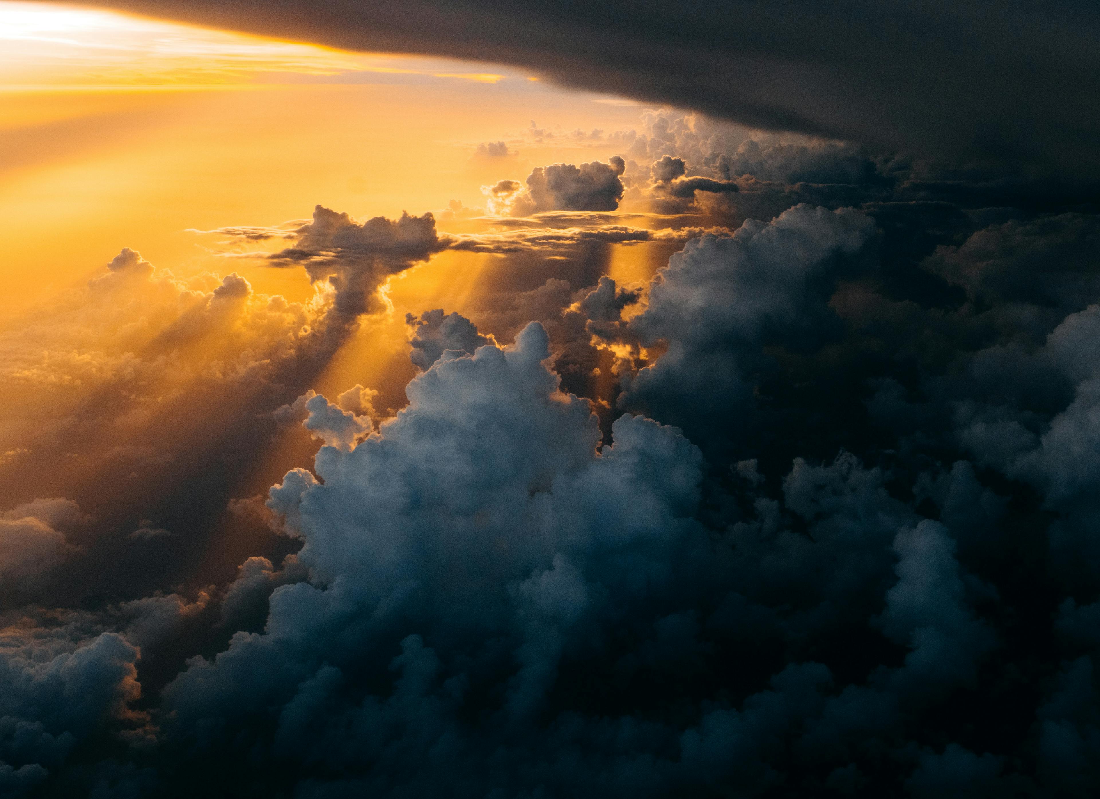 Sunset in the clouds (Tom Barrett  |  unsplash.com)